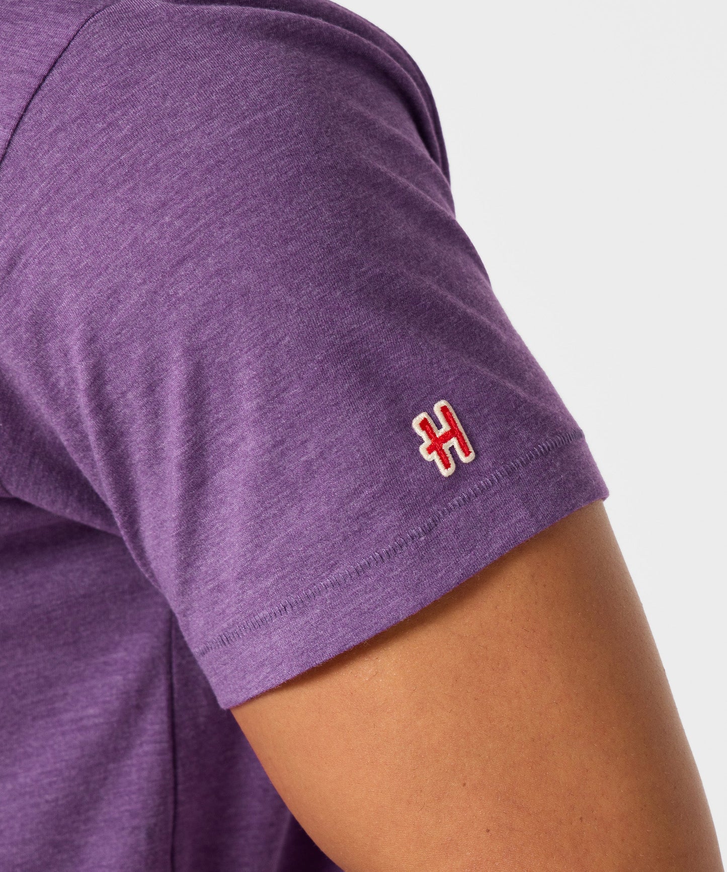 Folded royal purple t-shirt showing the classic short-sleeve silhouette