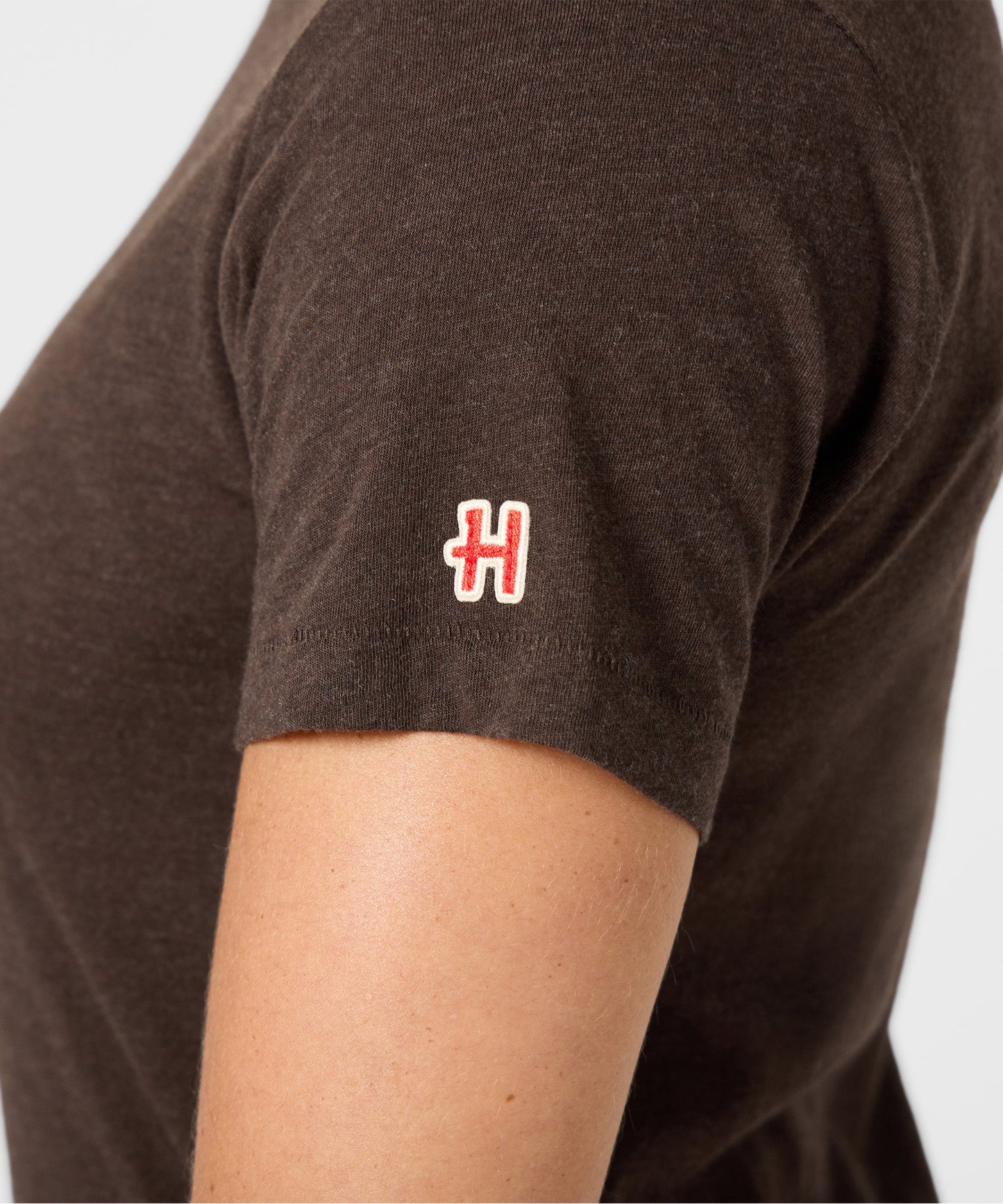 Folded view of the Peanuts Pig-Pen t-shirt showing the rich brown color