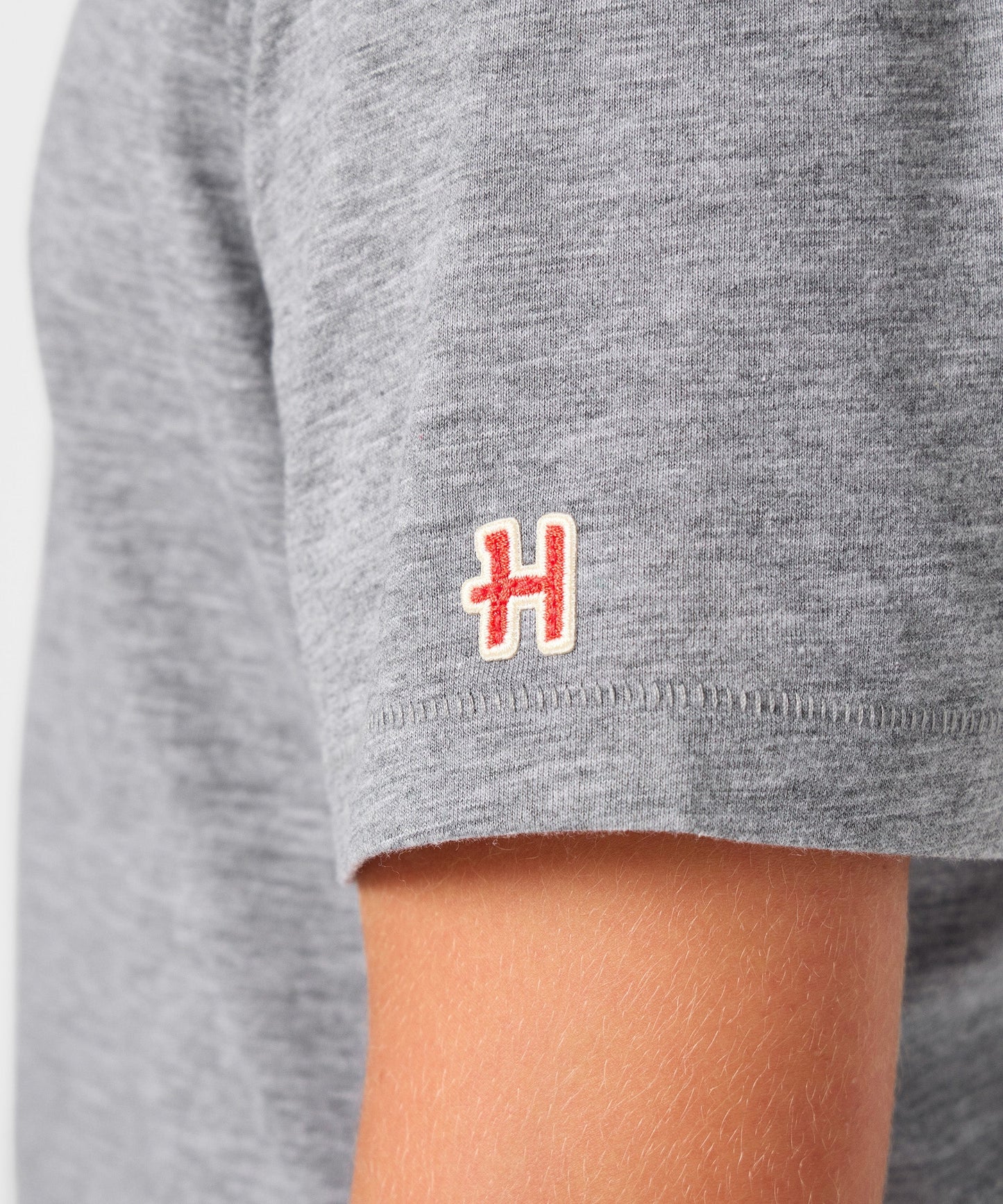 Lifestyle view of the youth t-shirt folded neatly on a flat surface