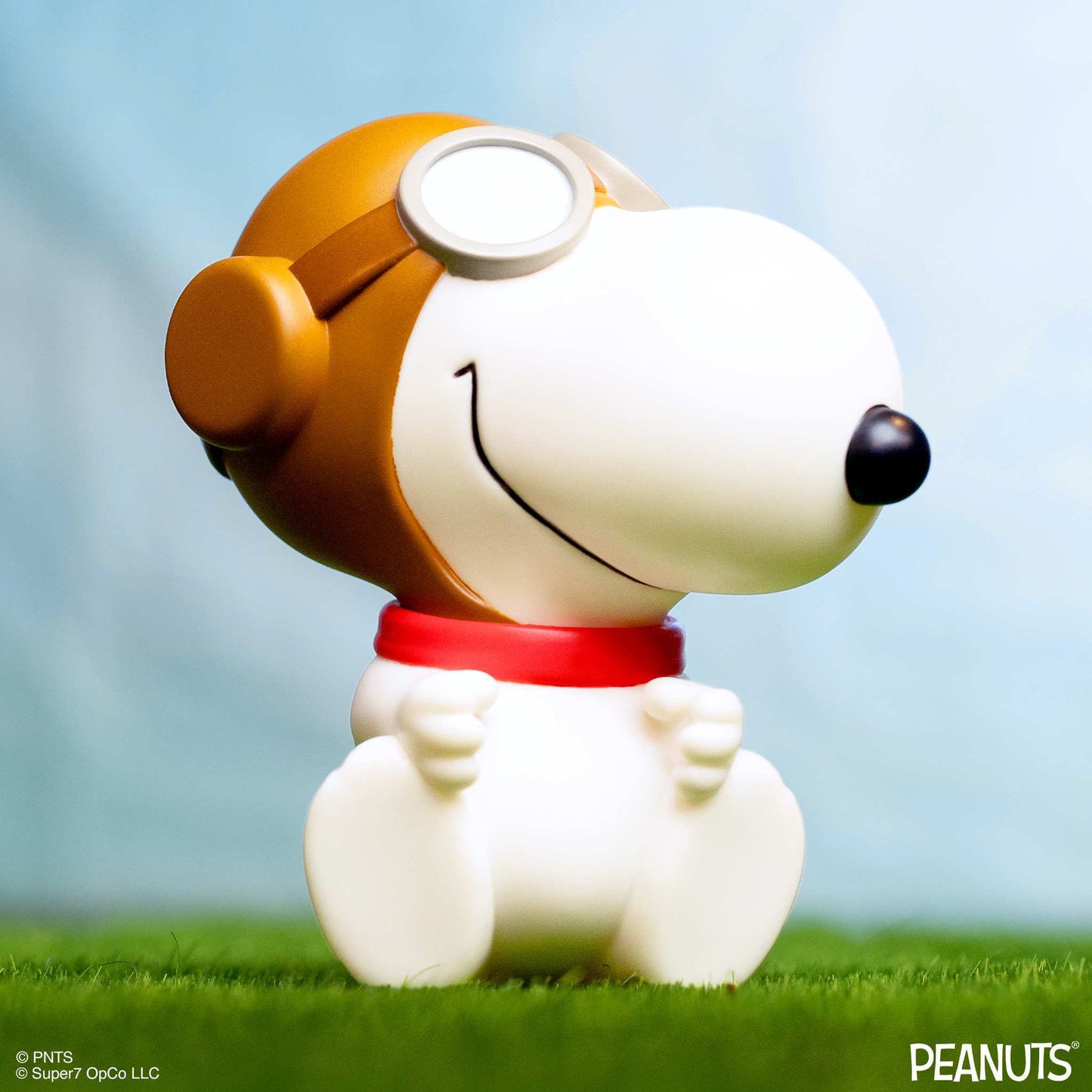 Front angle view of the Snoopy Flying Ace collectible figure in dynamic display packaging