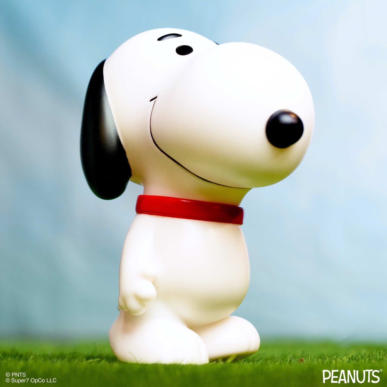 Front view of the Snoopy figure showing his classic black ears and red collar