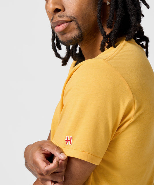 Gold crew-neck t-shirt featuring a vintage graphic of Charlie Brown centered on the front chest-4