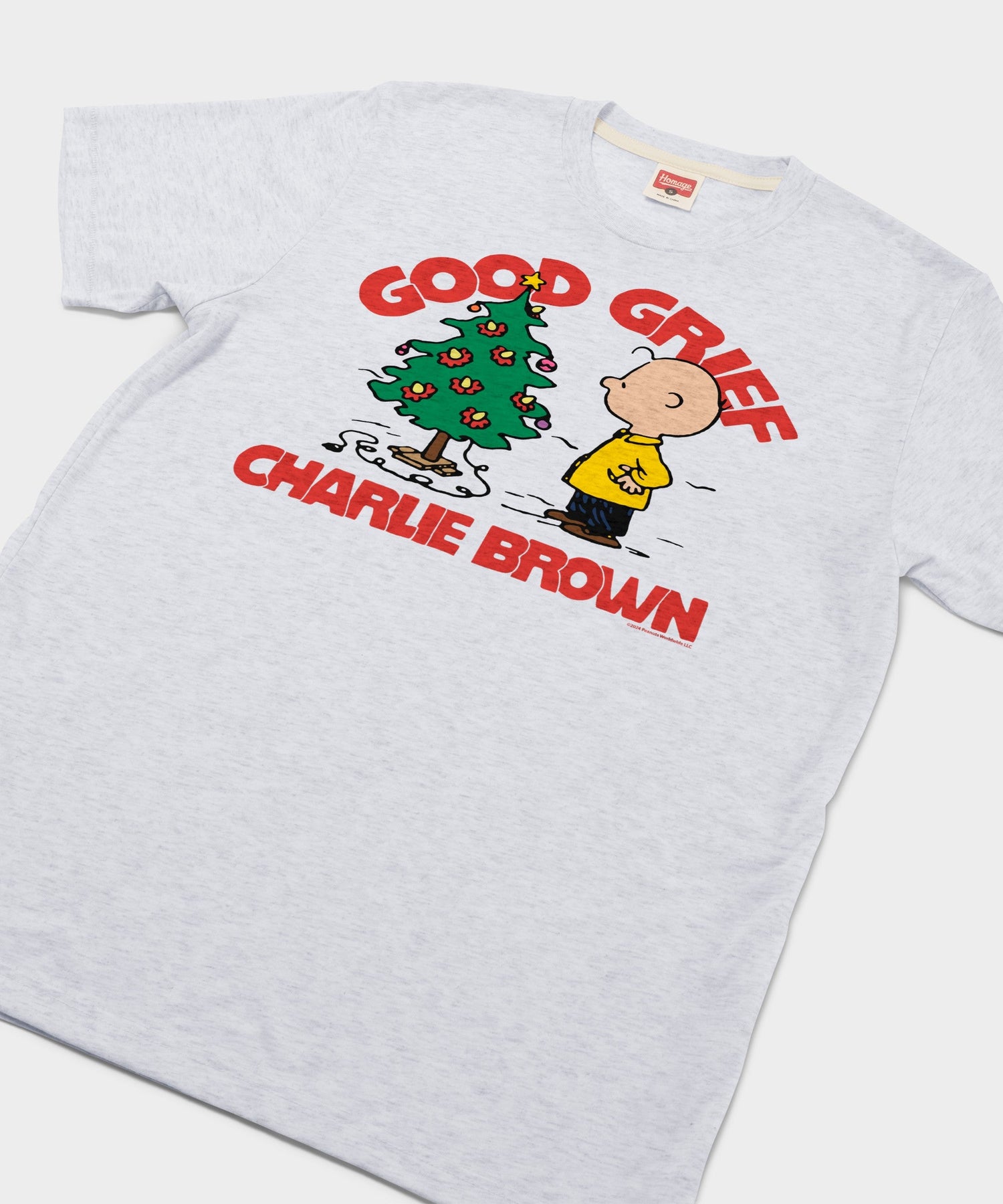 Close-up of the Charlie Brown Christmas graphic printed on the chest of the ash t-shirt