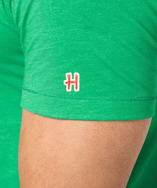 Green HOMAGE crew-neck t-shirt featuring a vintage Charlie Brown hockey graphic on the chest-4