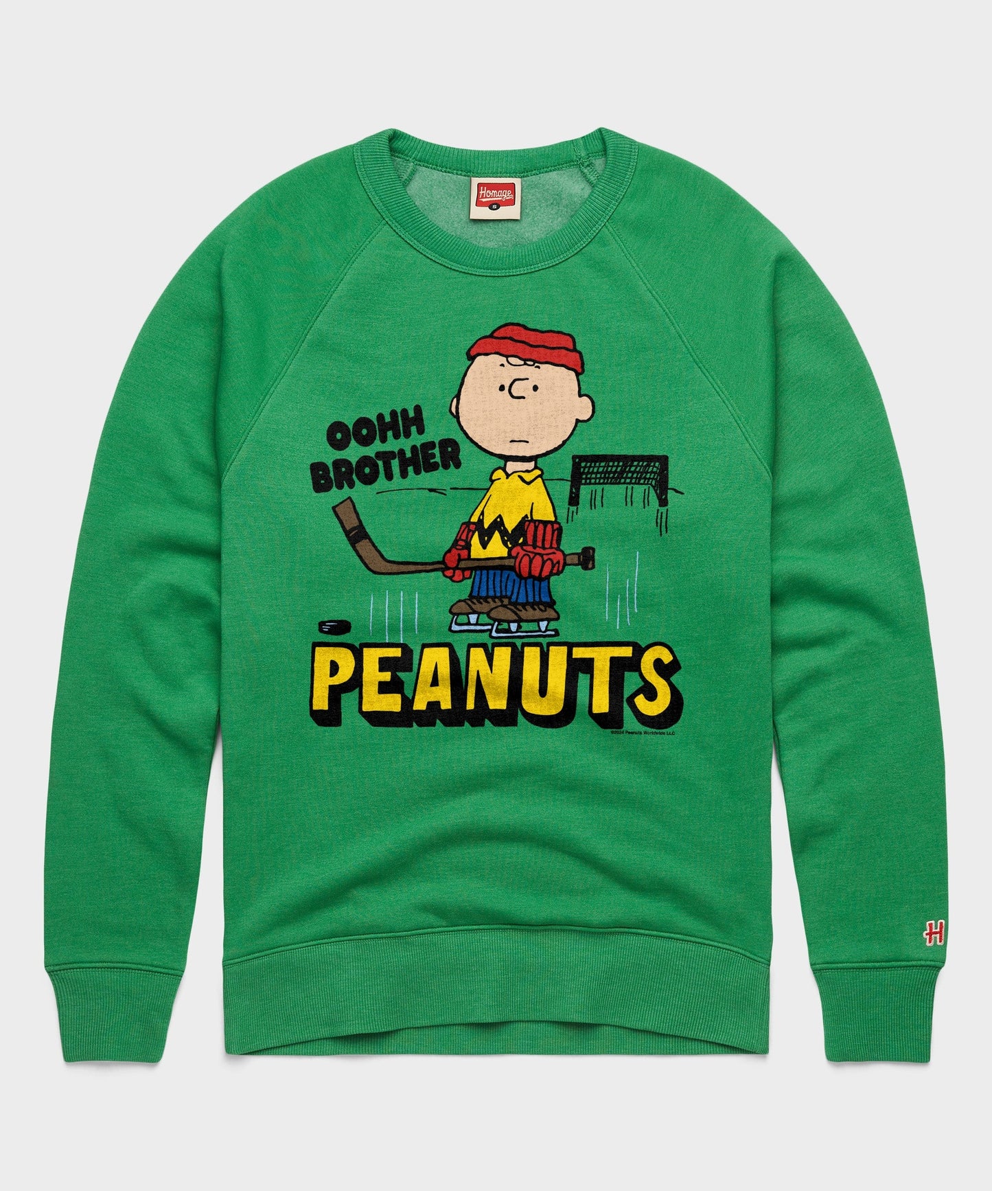 Green HOMAGE crewneck sweatshirt featuring a vintage Charlie Brown graphic centered on the chest