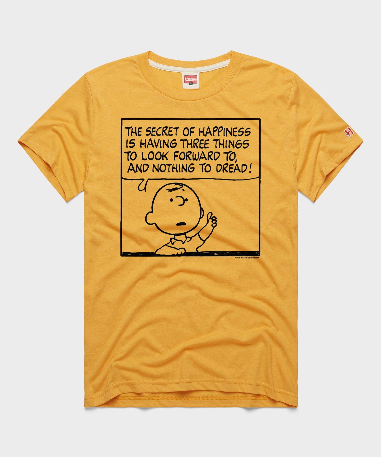 Gold crewneck t-shirt featuring a vintage Charlie Brown graphic centered on the front chest