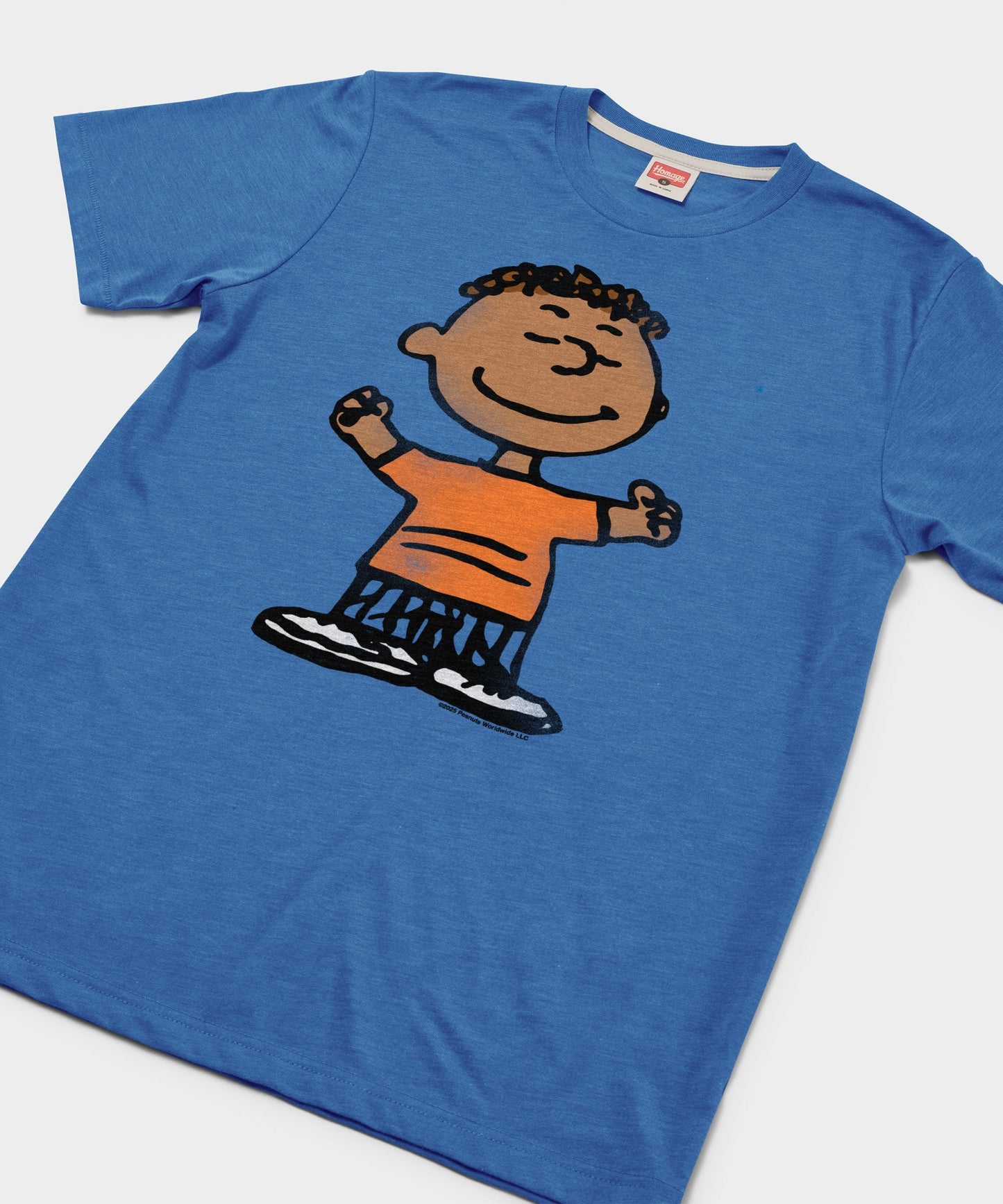 Close-up of the Franklin graphic print on the front of the royal blue t-shirt