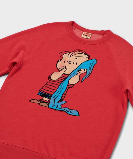 Red crew-neck sweatshirt featuring Linus van Pelt holding his blue security blanket centered on the front-1