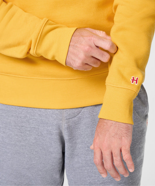 Gold crewneck sweatshirt featuring Linus standing with his blue blanket in the snow on the chest-4