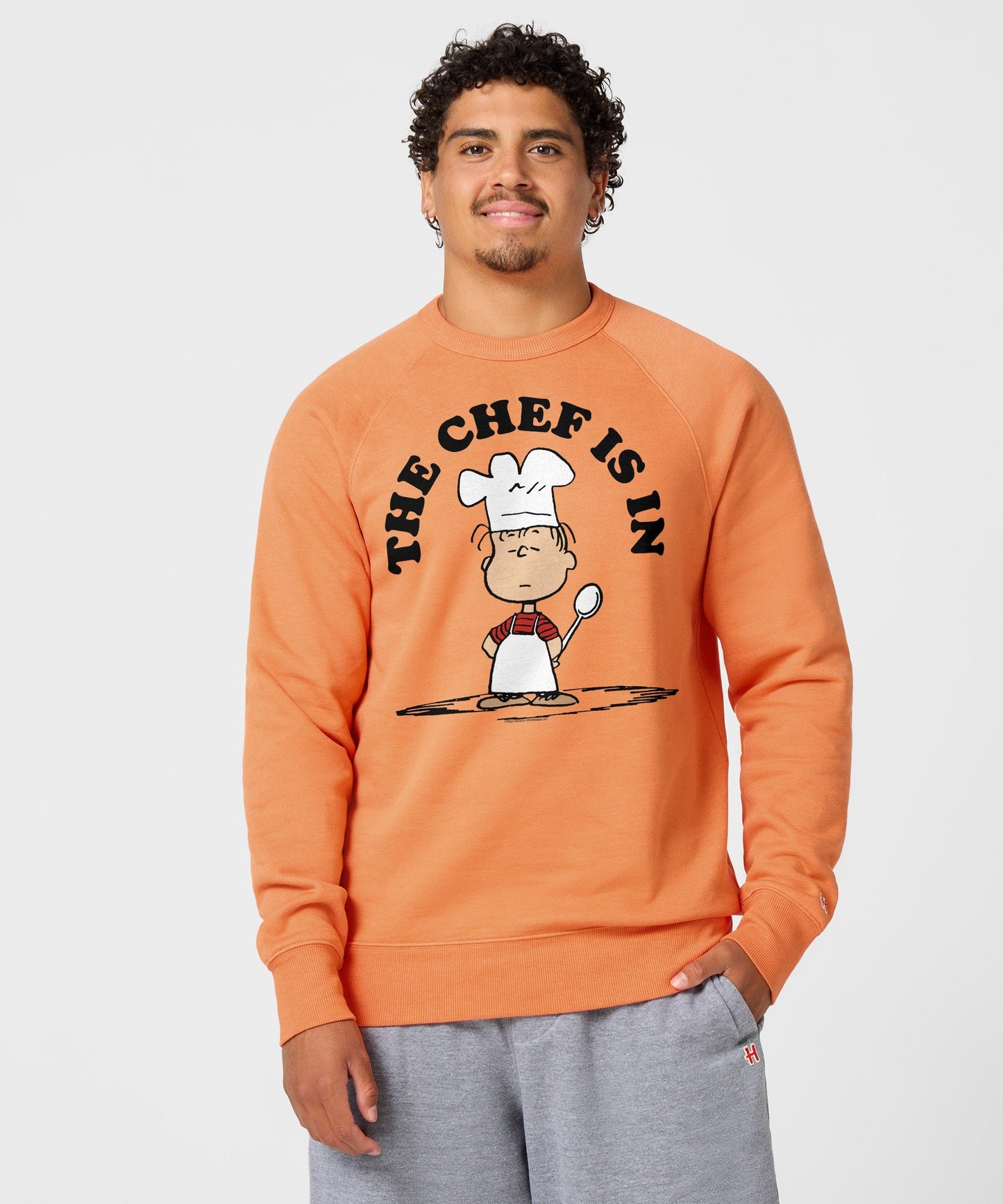 Back view of the solid orange crewneck sweatshirt