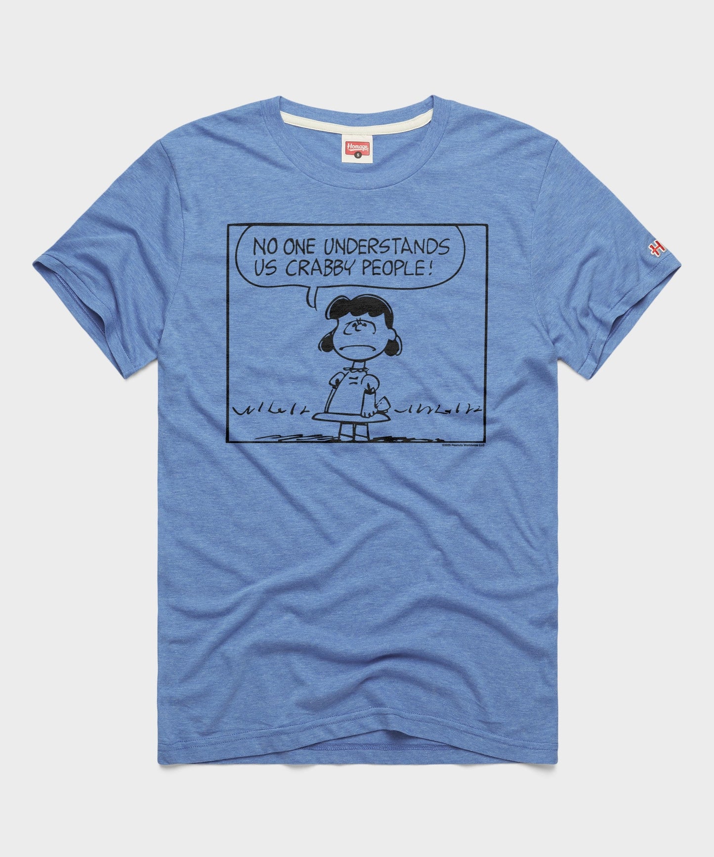 Light blue HOMAGE x Peanuts t-shirt featuring a graphic of Lucy van Pelt with the text Crabby People centered on the front