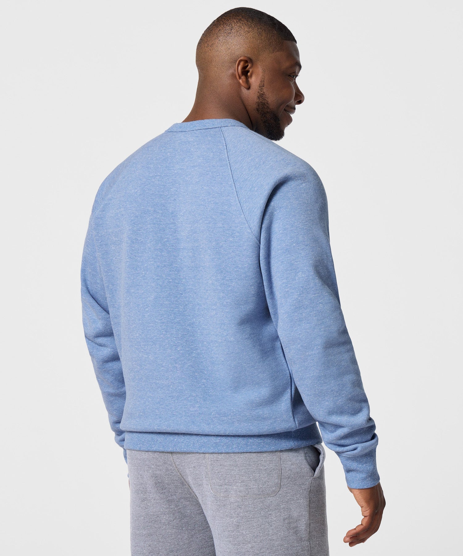 Detailed view of the ribbed collar and neckline construction on the sweatshirt