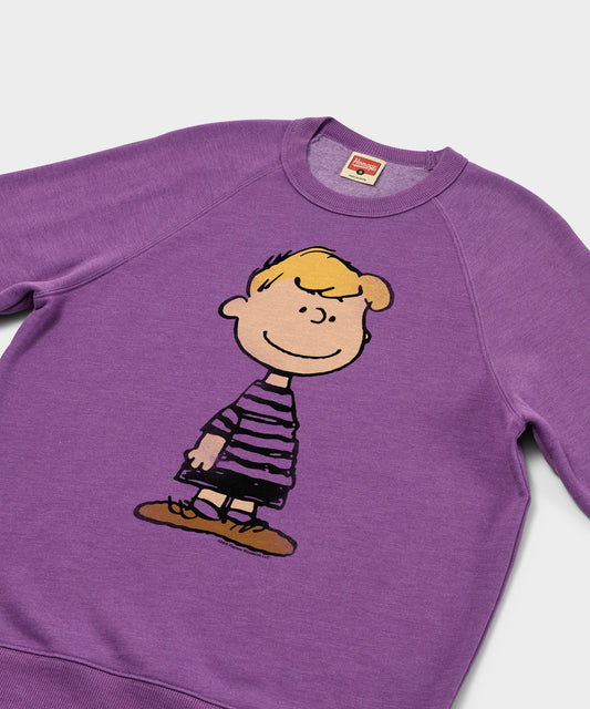 Royal purple crew-neck sweatshirt featuring a graphic of Schroeder playing his piano on the front chest-1