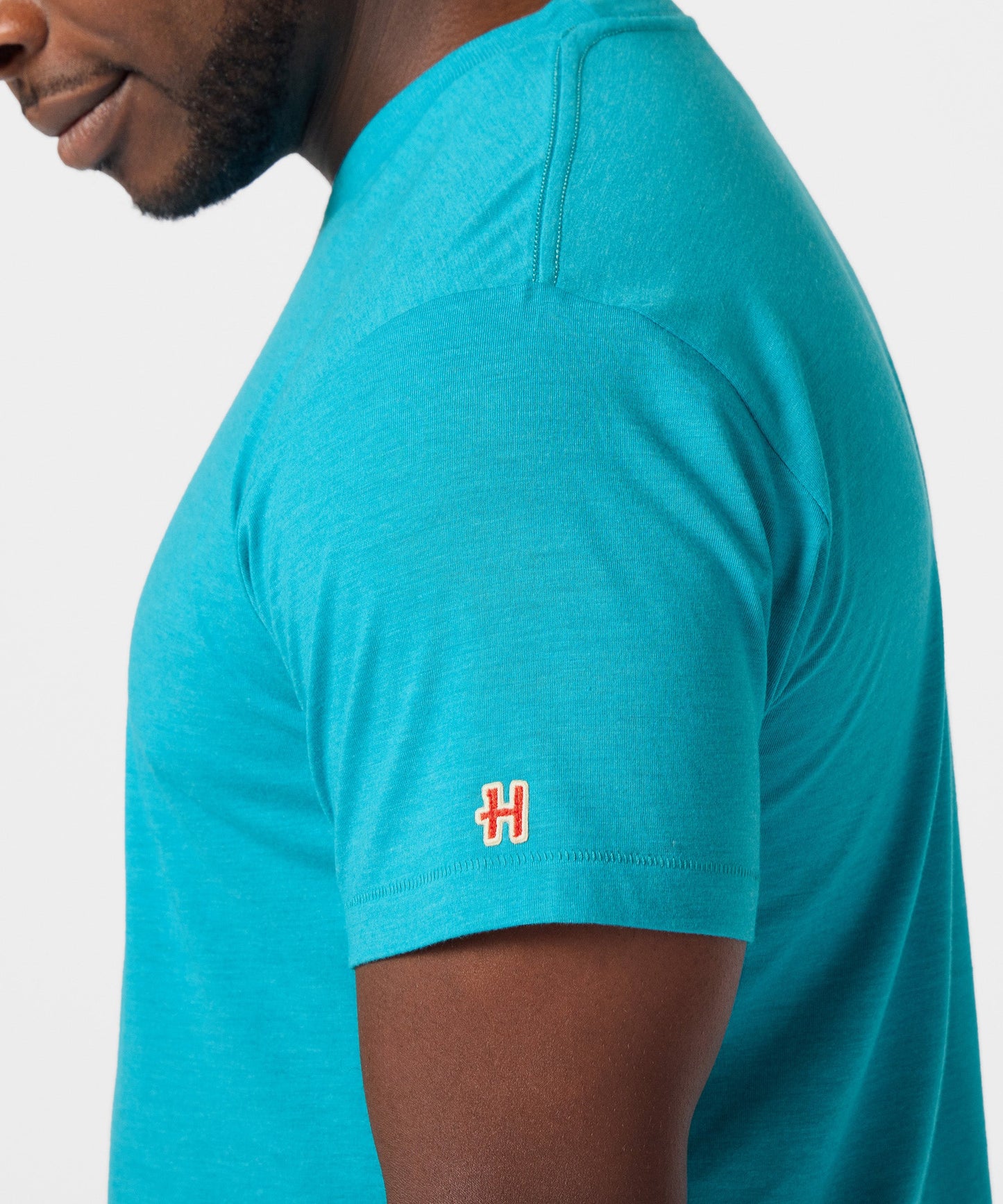 Interior collar view showing the official Peanuts and HOMAGE collaboration neck branding