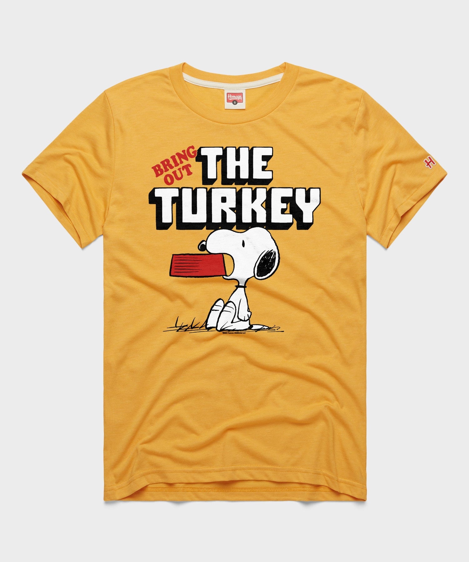 Gold crew-neck t-shirt featuring Charlie Brown and Snoopy graphic on the front chest