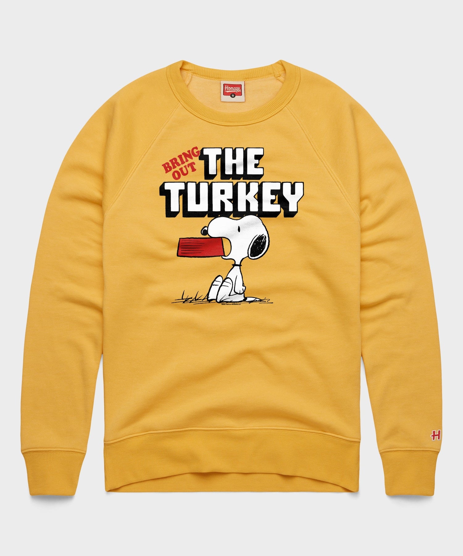 Gold crewneck sweatshirt featuring Snoopy and a Bring Out The Turkey graphic on the front chest