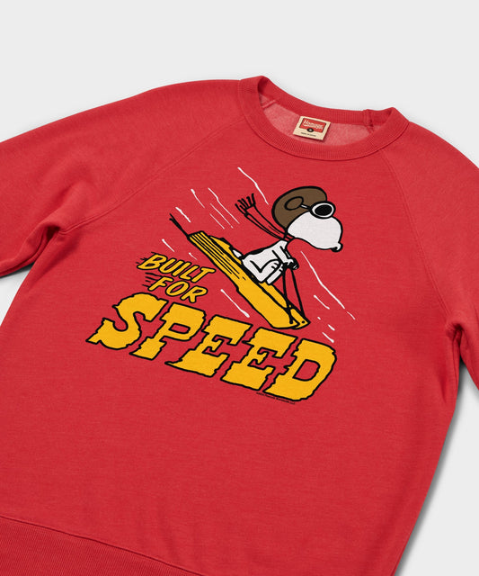 Red crewneck sweatshirt featuring Snoopy sledding with the Peanuts gang on the front chest-1