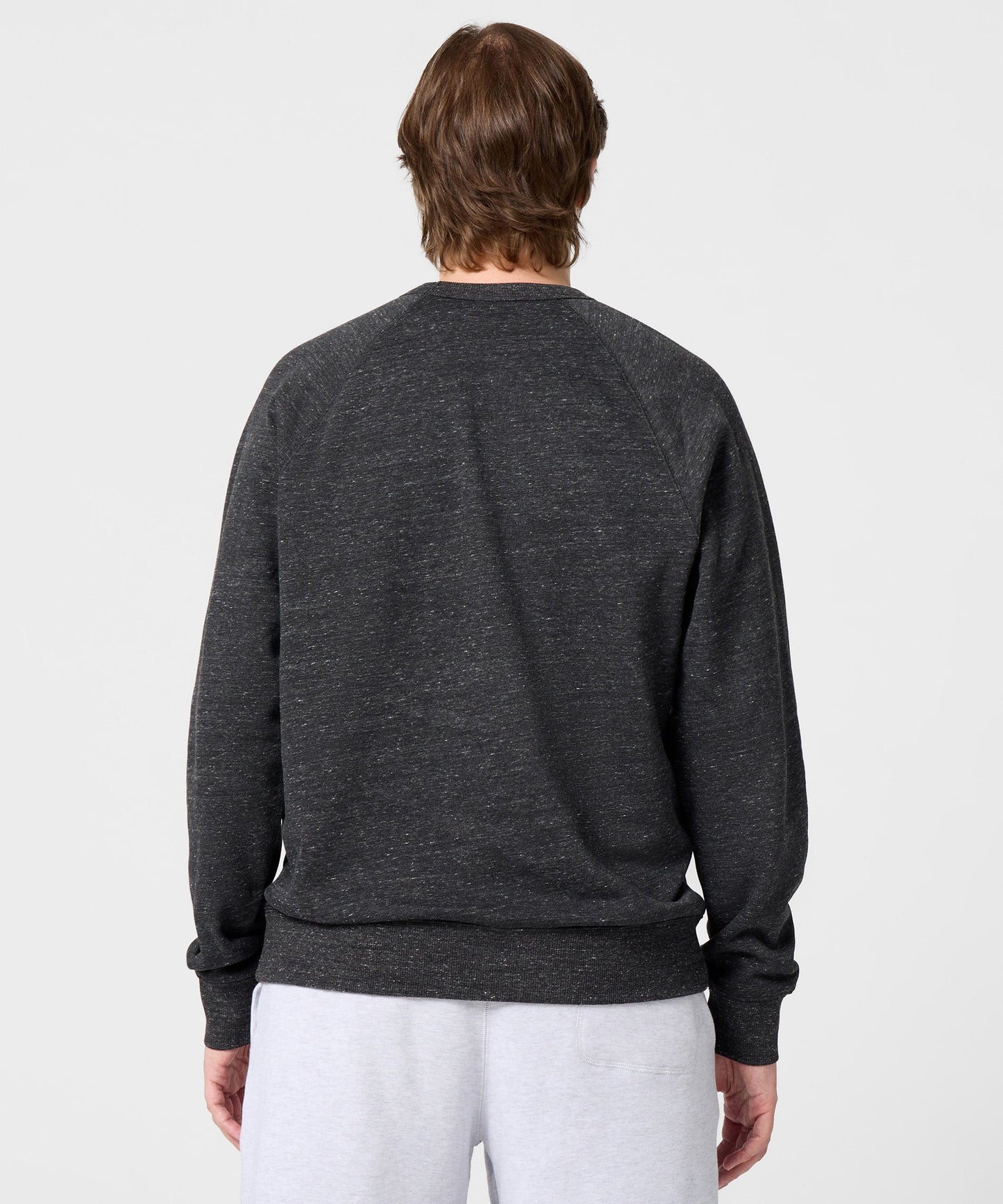 Detailed close-up of the ribbed crew collar and interior HOMAGE brand tagging