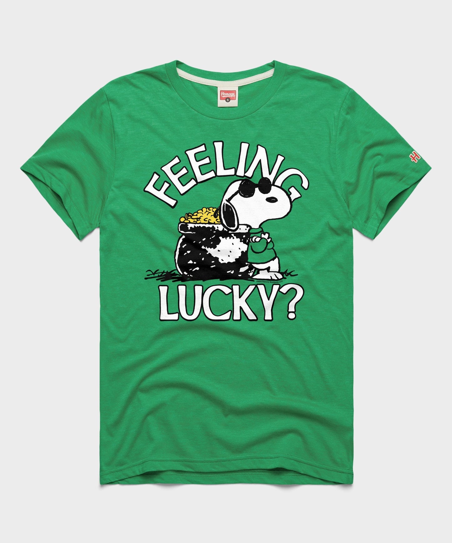 Green short-sleeve t-shirt with a graphic of Snoopy celebrating on the front chest