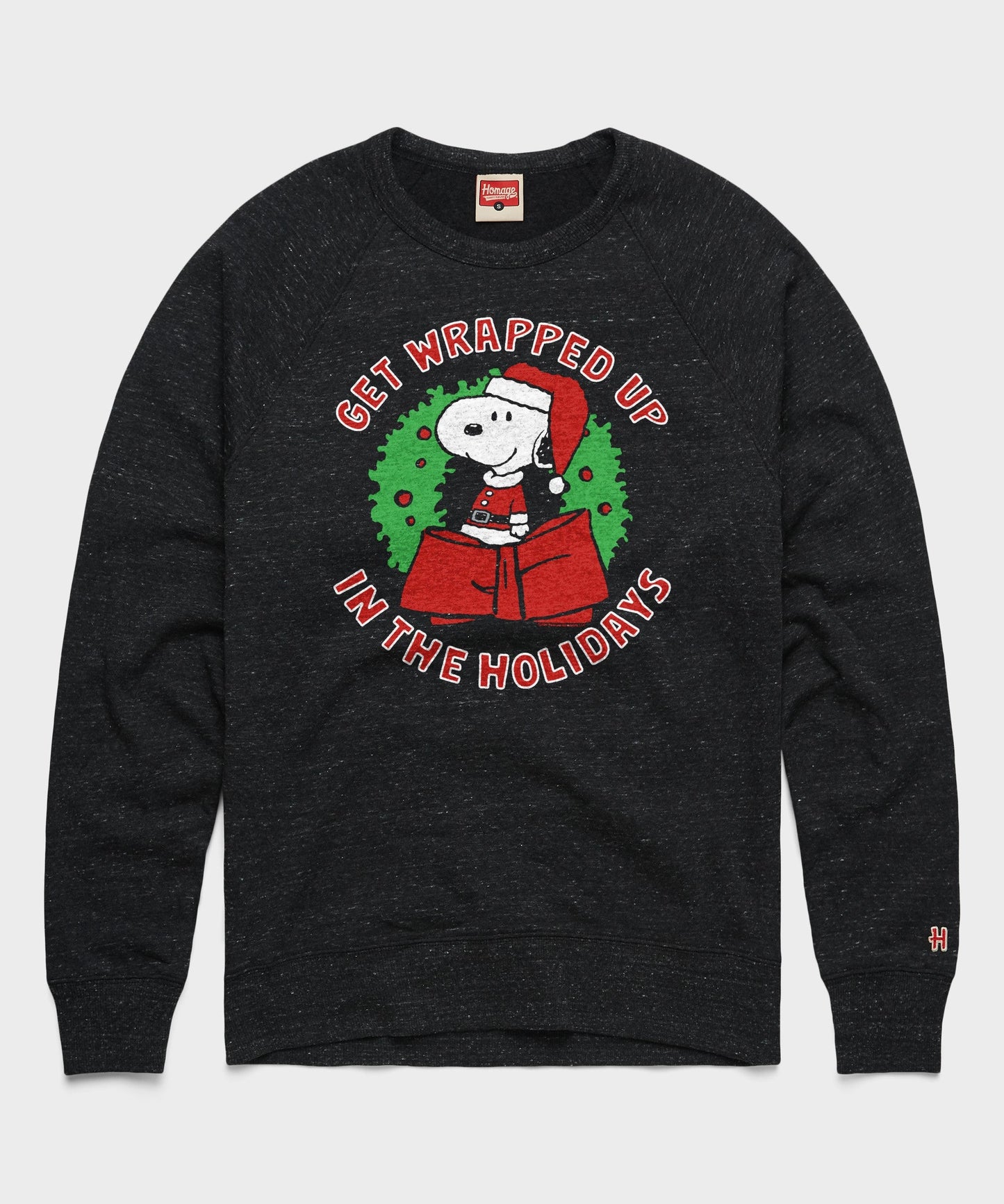 Charcoal crewneck sweatshirt featuring Snoopy getting wrapped up in ribbon on the front chest