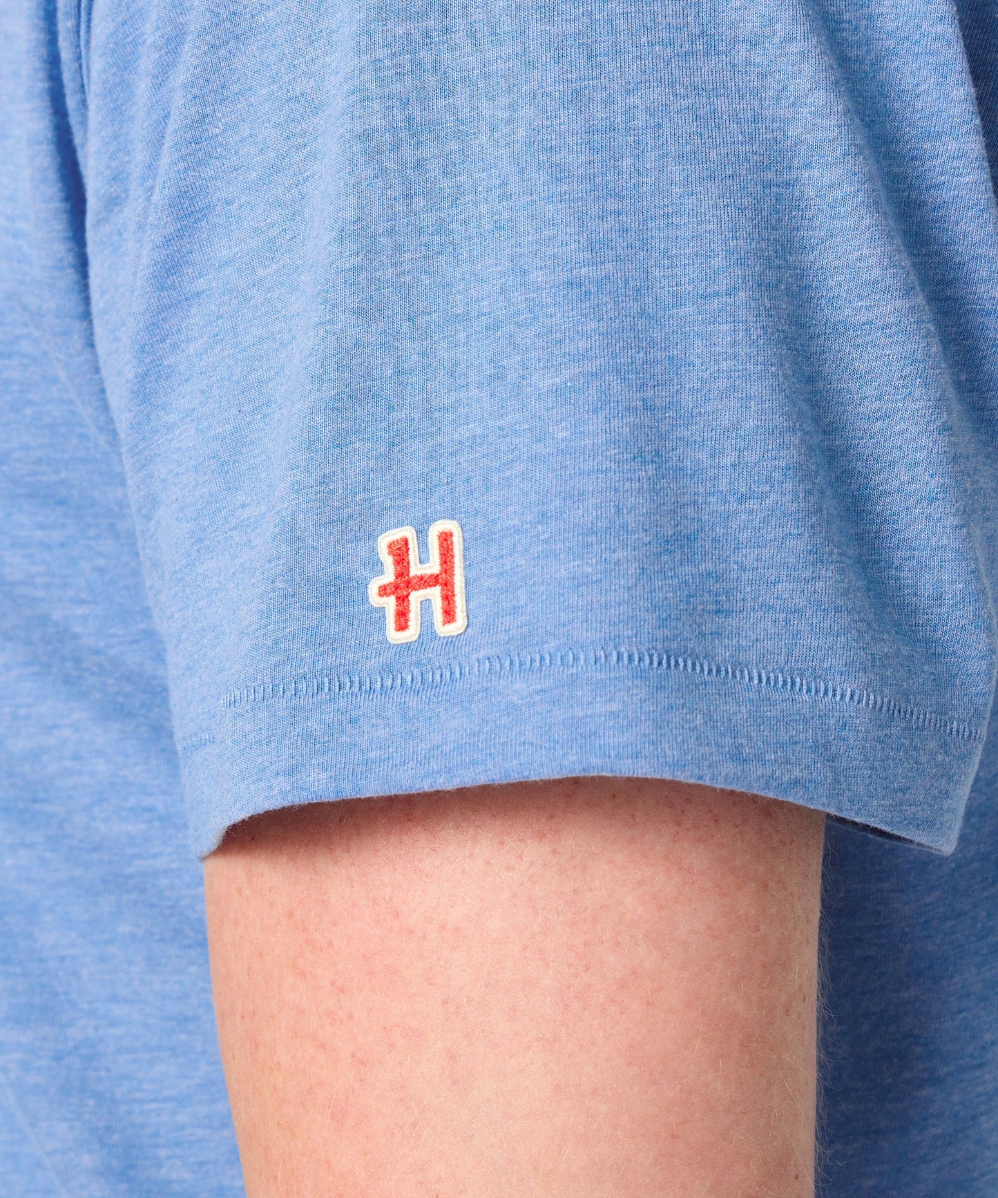 Folded light blue Peanuts t-shirt showcasing the soft cotton fabric texture