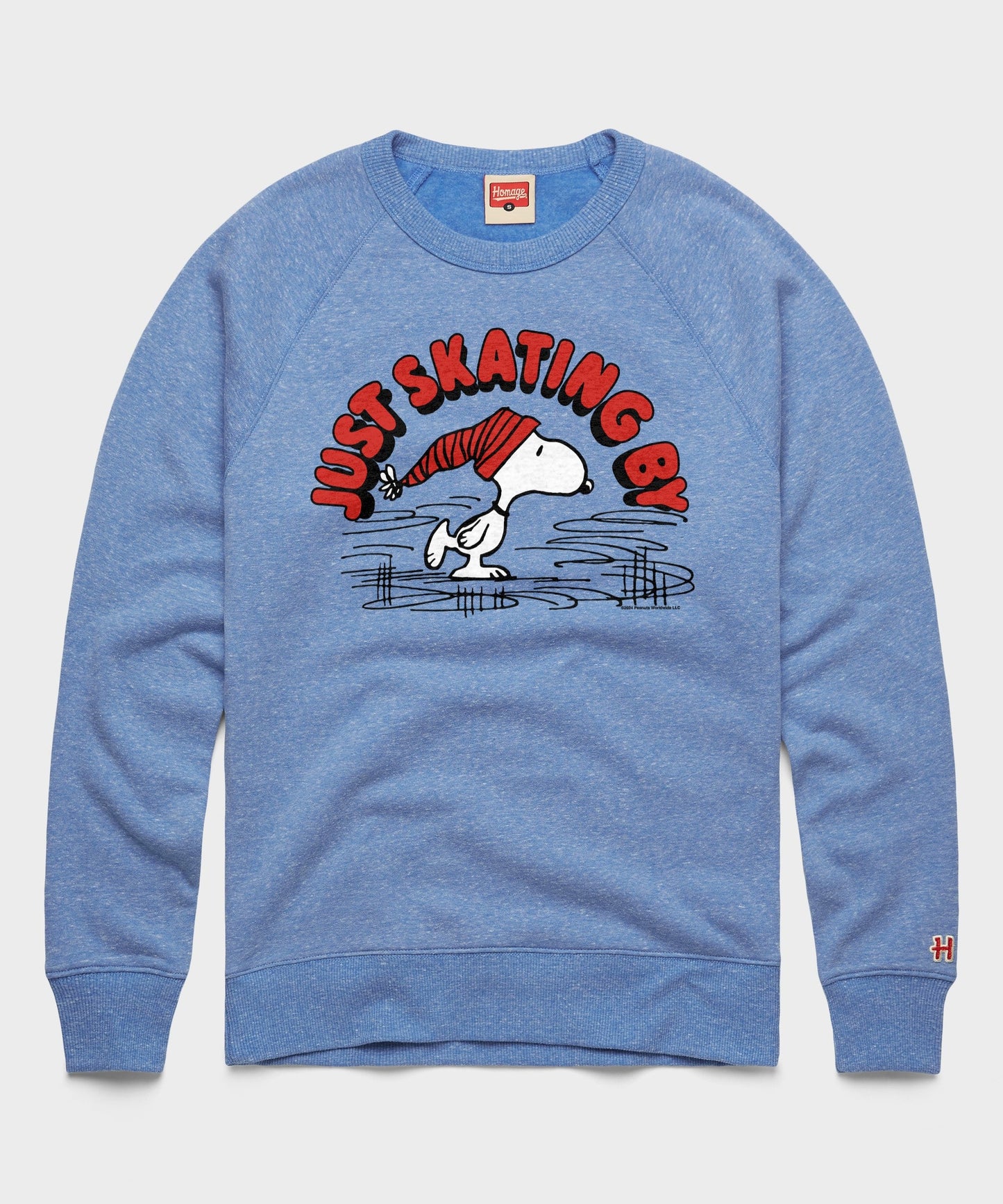 Light blue crewneck sweatshirt featuring Snoopy ice skating across the front chest