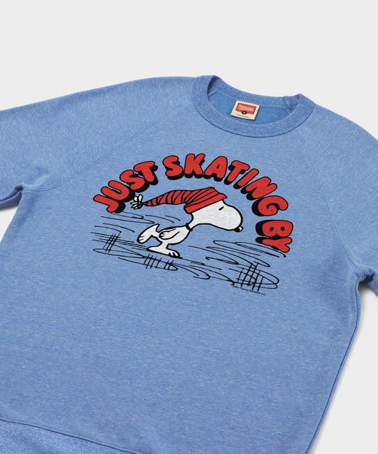 Light blue crewneck sweatshirt featuring Snoopy ice skating across the front chest-1