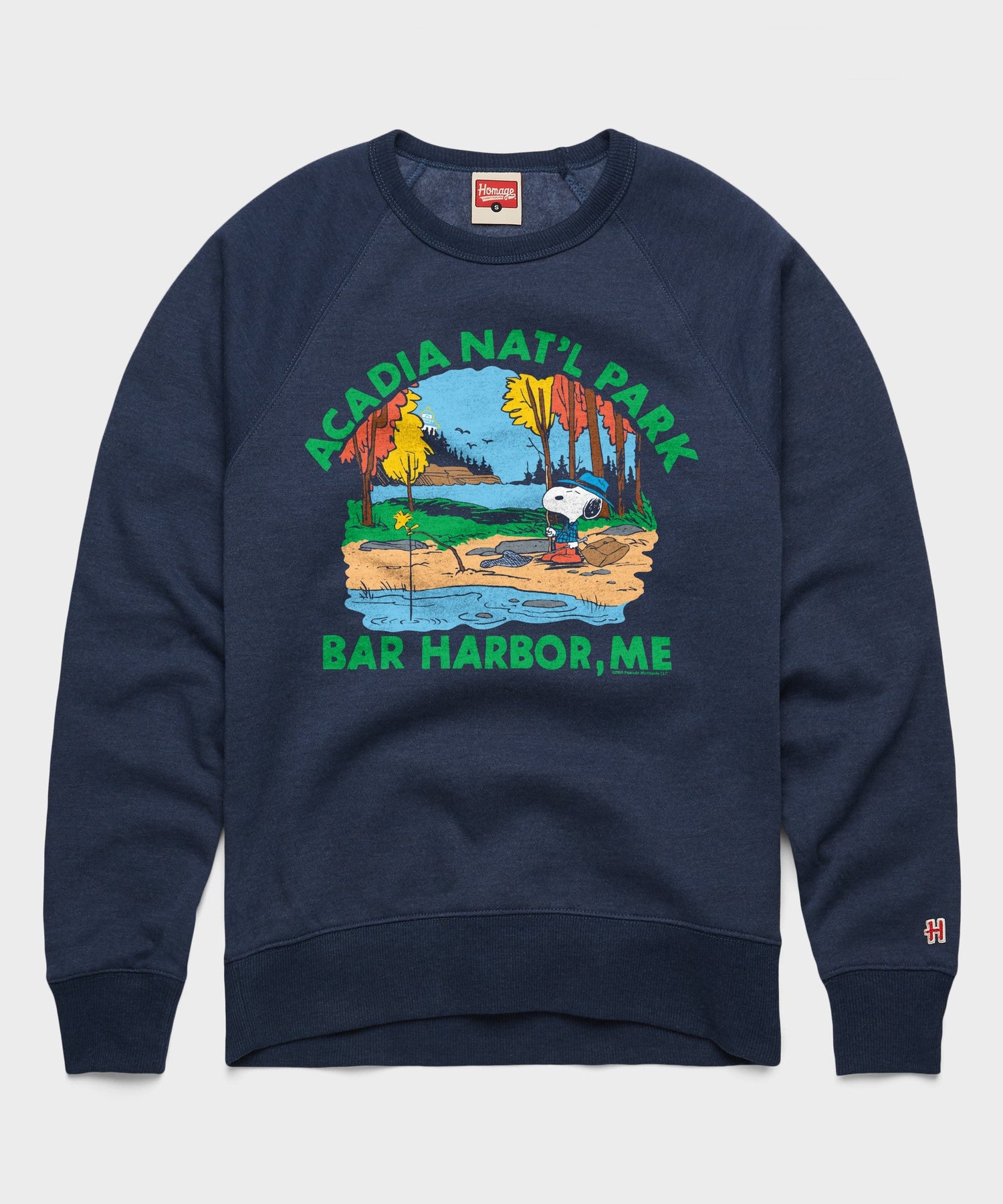 Navy crewneck sweatshirt featuring Snoopy lounging in Acadia National Park on the front chest