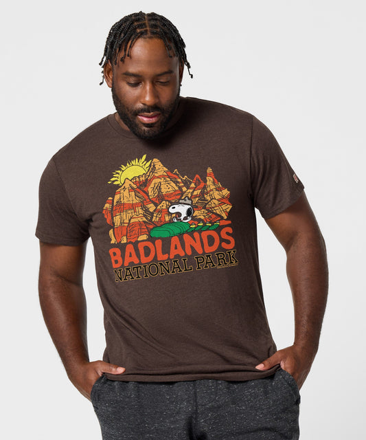 Brown t-shirt featuring Snoopy exploring Badlands National Park on the front chest-2