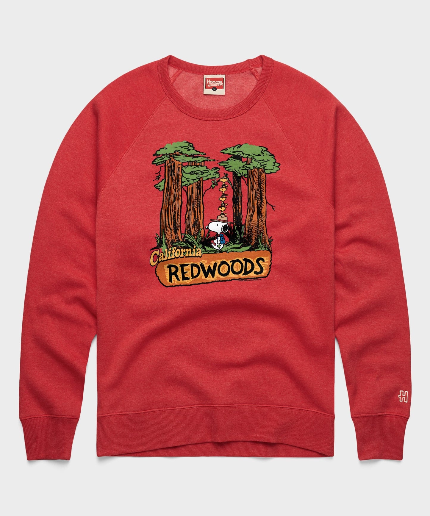 Red crewneck sweatshirt featuring a graphic of Snoopy in the California Redwoods on the front
