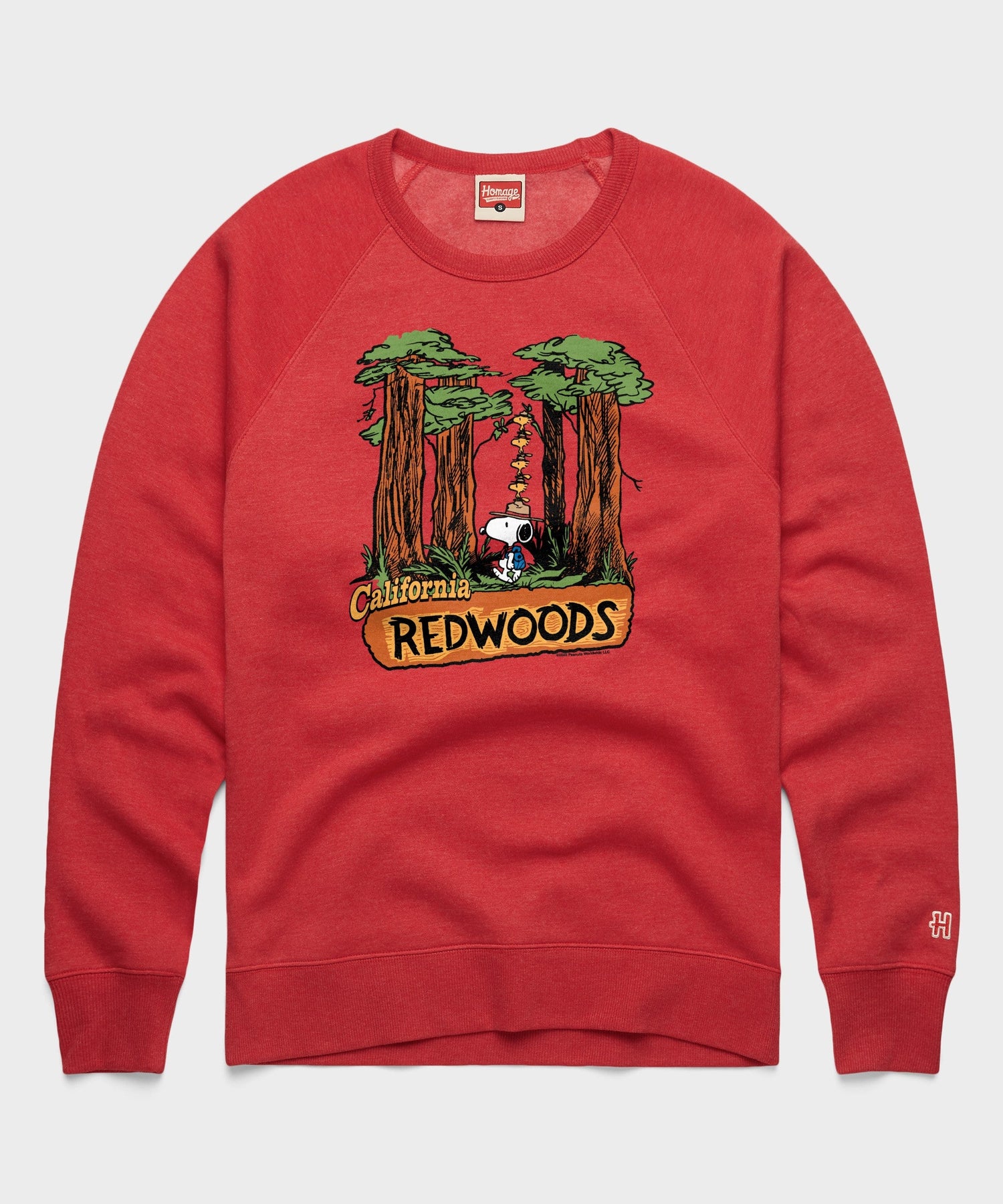 Red crewneck sweatshirt featuring a graphic of Snoopy in the California Redwoods on the front
