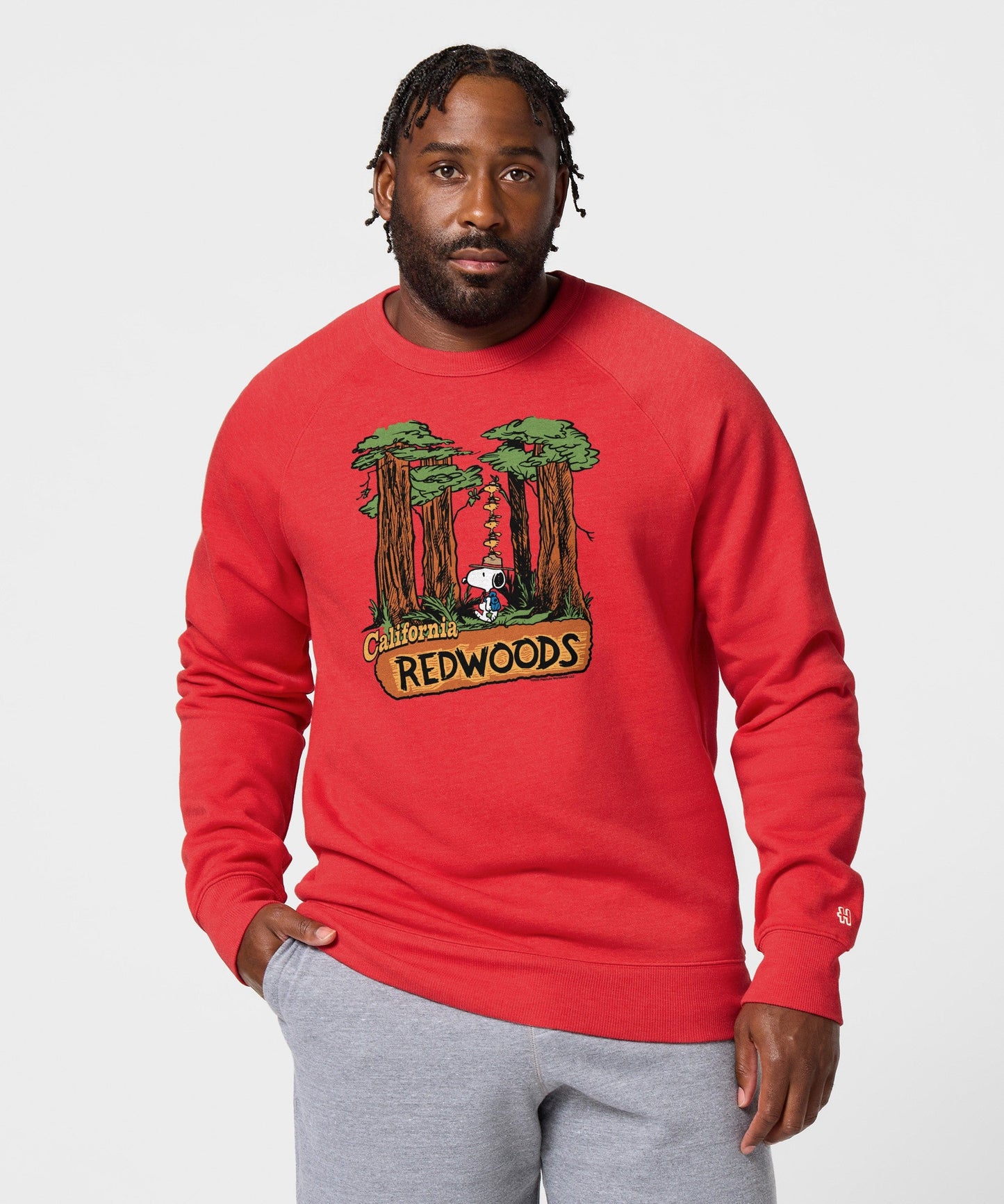 Detailed view of the soft cotton blend fabric and collar construction of the red pullover