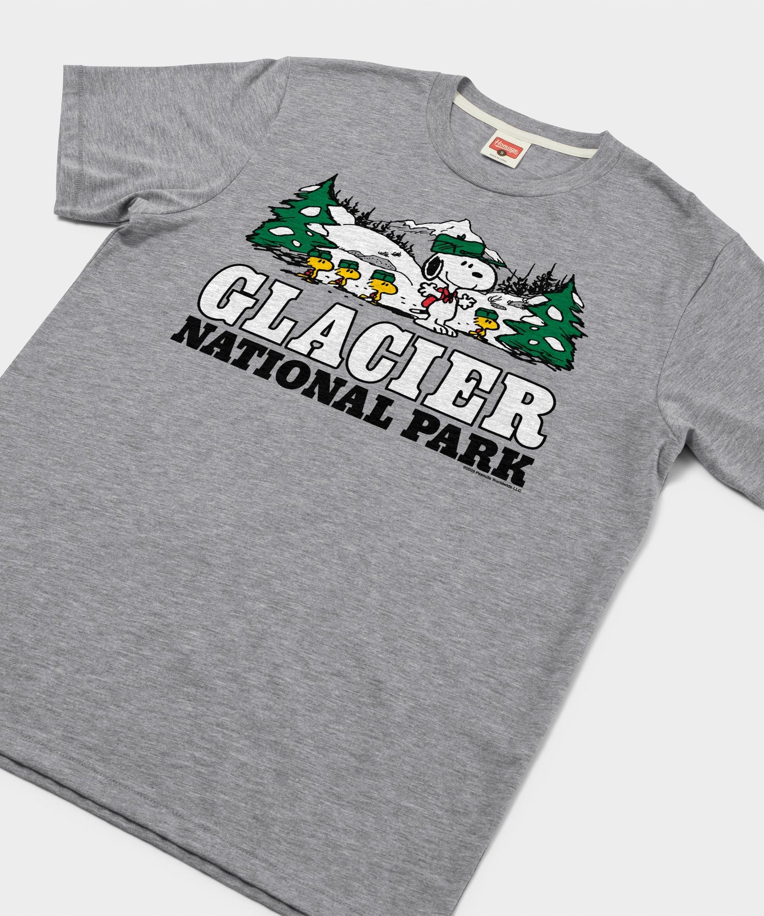 Close-up of the front chest graphic showing Snoopy exploring Glacier National Park
