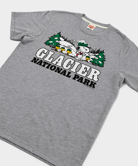 Heather grey unisex t-shirt featuring a vintage graphic of Snoopy resting against a tree in Glacier National Park on the front-1