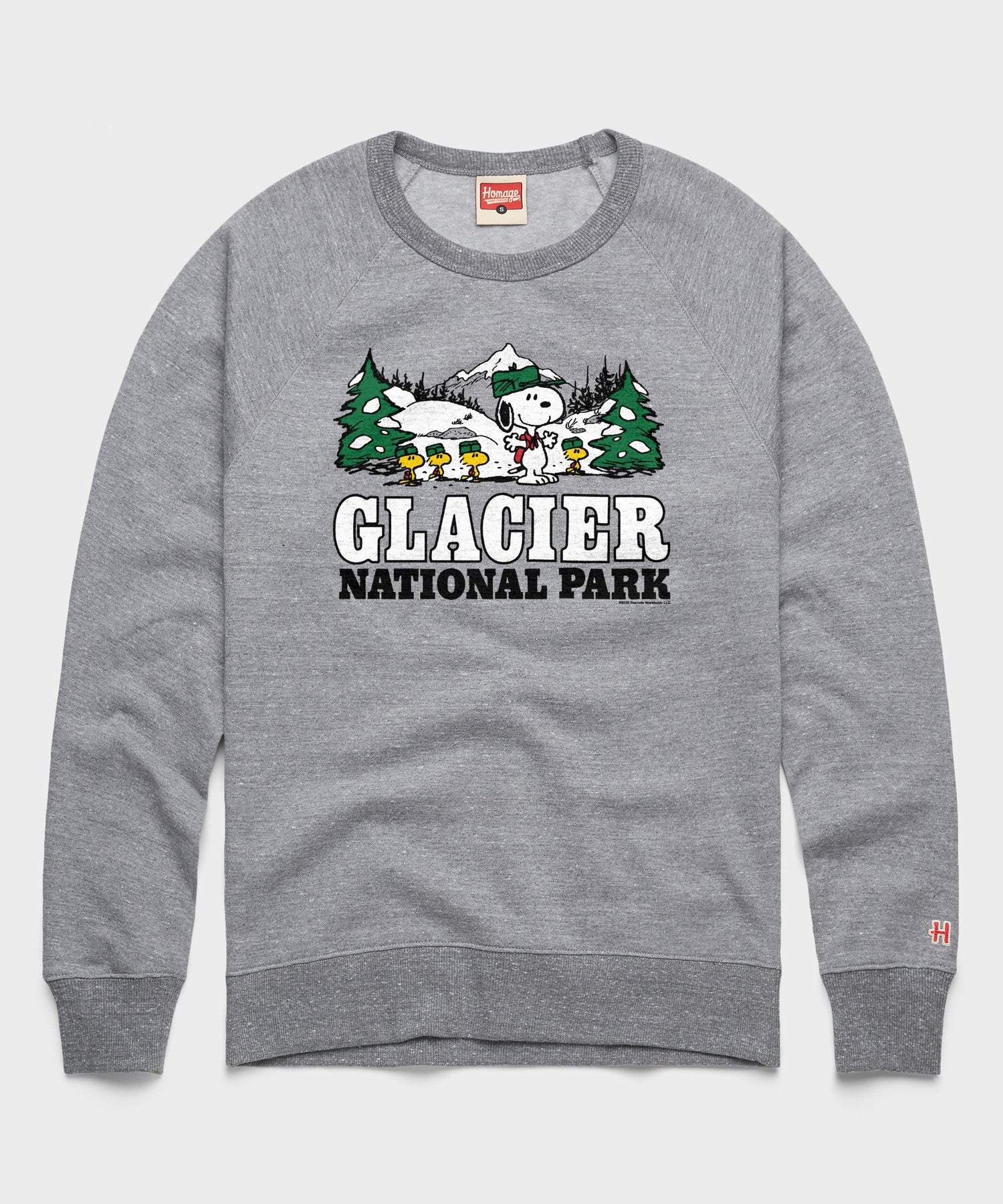 Gray crewneck sweatshirt featuring Snoopy ready for an alpine adventure in Glacier National Park printed on the front chest
