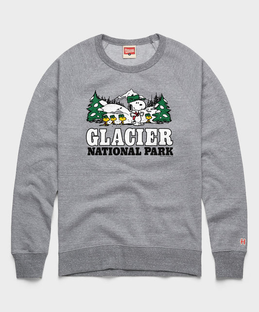 Gray crewneck sweatshirt featuring Snoopy ready for an alpine adventure in Glacier National Park printed on the front chest-0