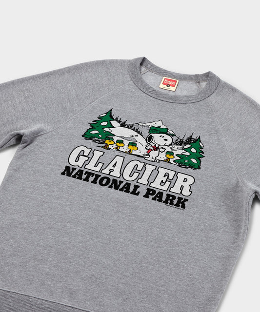 Gray crewneck sweatshirt featuring Snoopy ready for an alpine adventure in Glacier National Park printed on the front chest-1