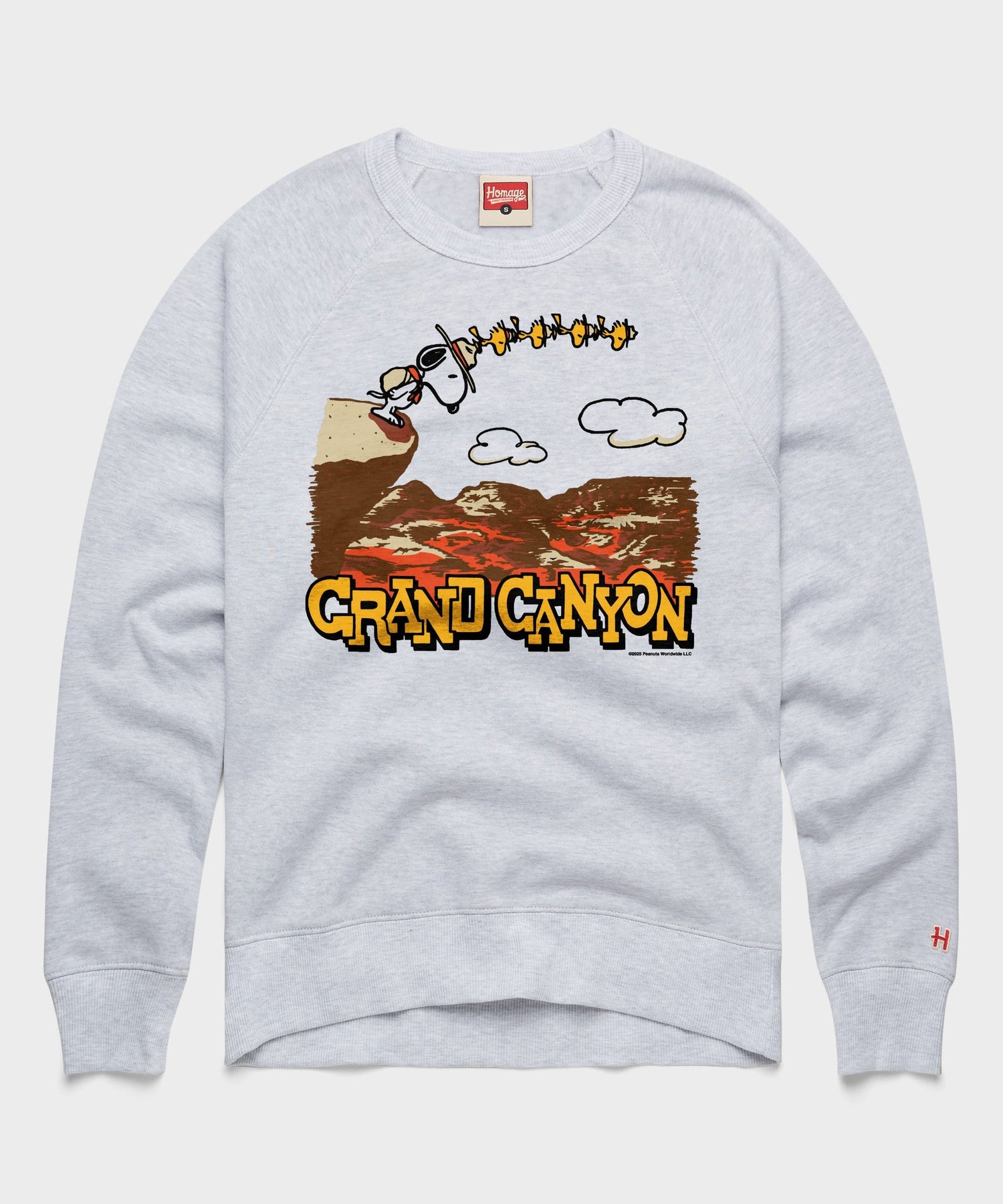Ash crewneck sweatshirt featuring Snoopy relaxing near a Grand Canyon National Park graphic on the front chest