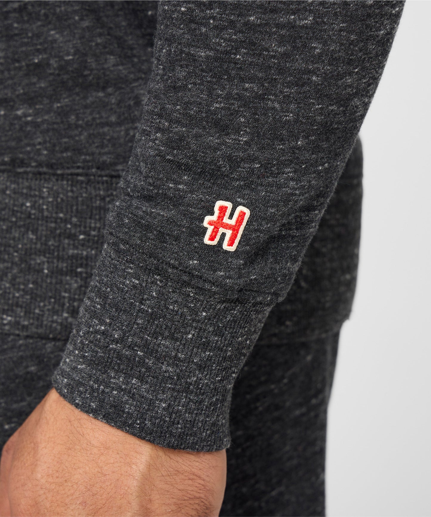 Folded view of the charcoal Peanuts National Parks sweatshirt highlighting the cozy cotton blend fabric