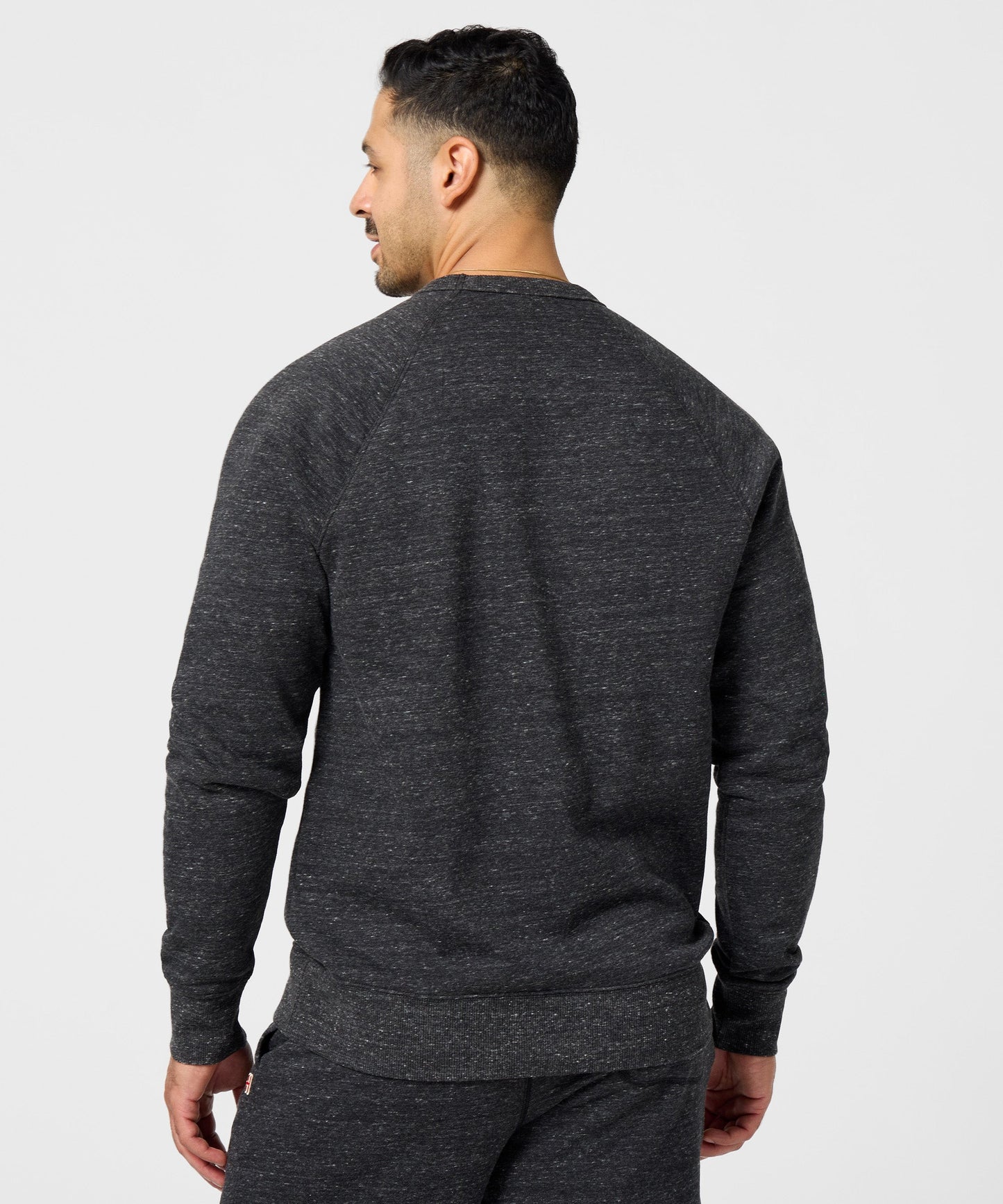 Close-up of the HOMAGE brand tag and soft interior fleece lining inside the collar