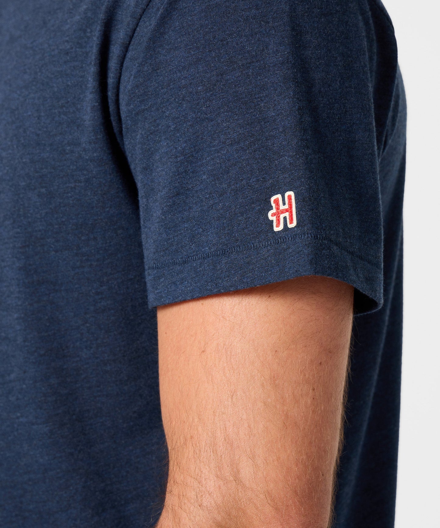 Folded view of the navy blue Peanuts soccer t-shirt
