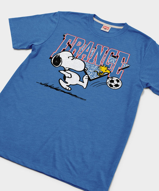 HOMAGE x Peanuts Snoopy and France soccer t-shirt, royal blue front view featuring Snoopy playing soccer-1