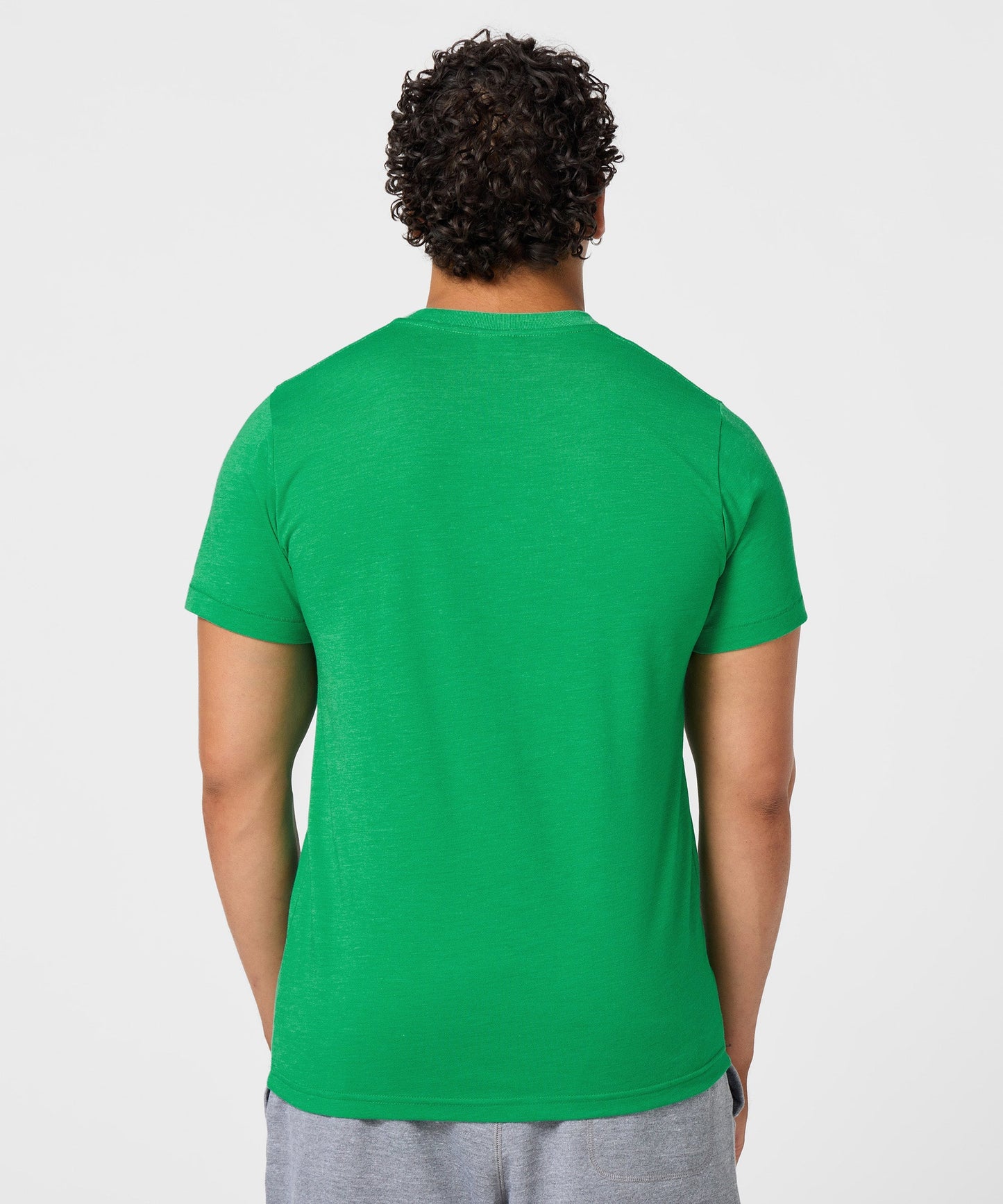 Fabric close-up showing the soft tri-blend texture and green color