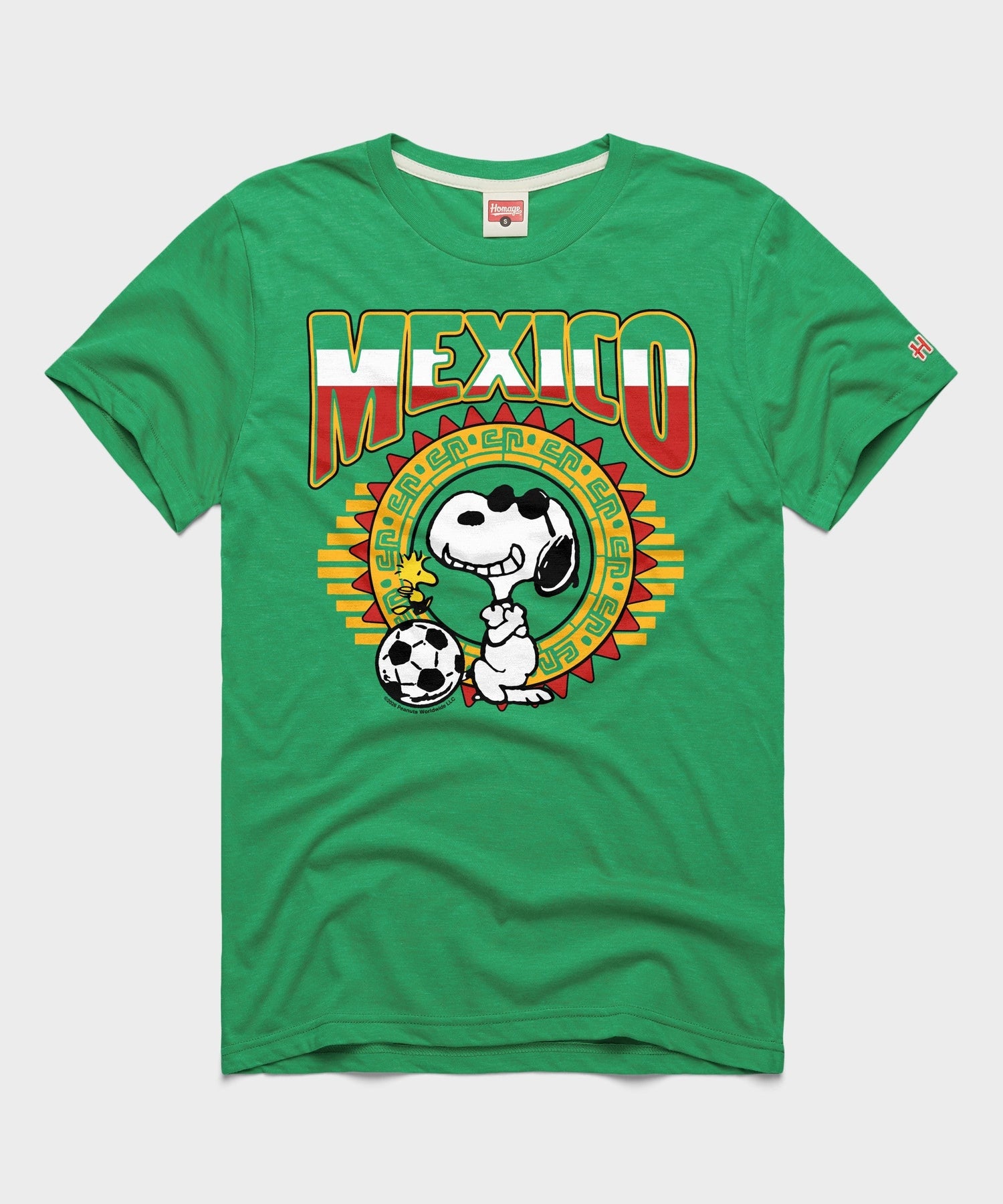 Green tri-blend t-shirt featuring Snoopy playing soccer for the Mexico national team on the front chest