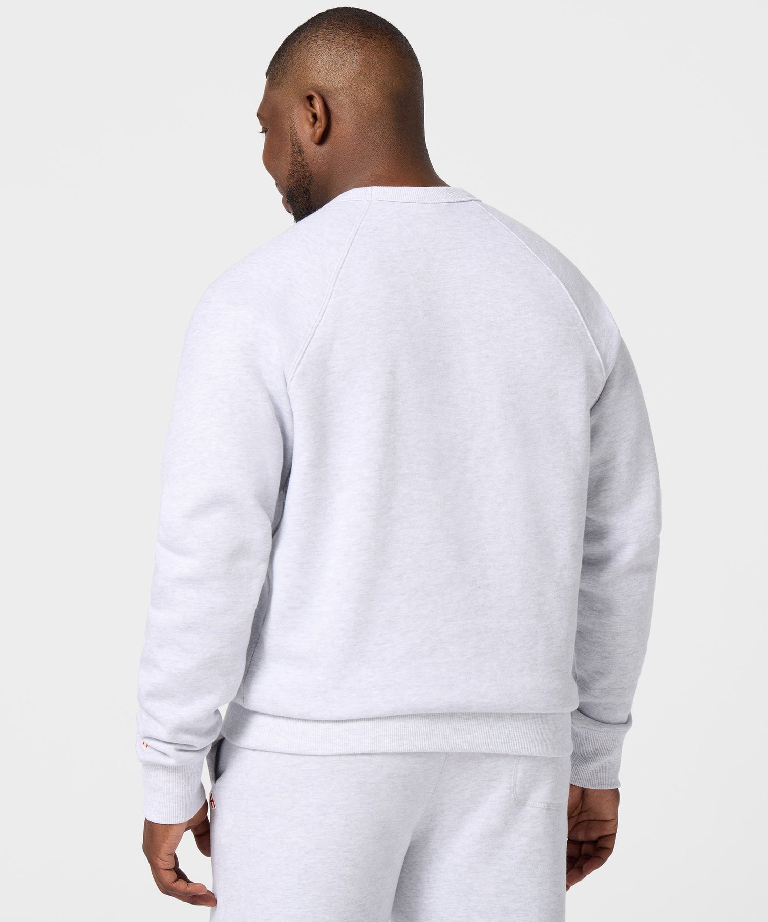 Back view of the ash grey crewneck sweatshirt, plain solid fabric