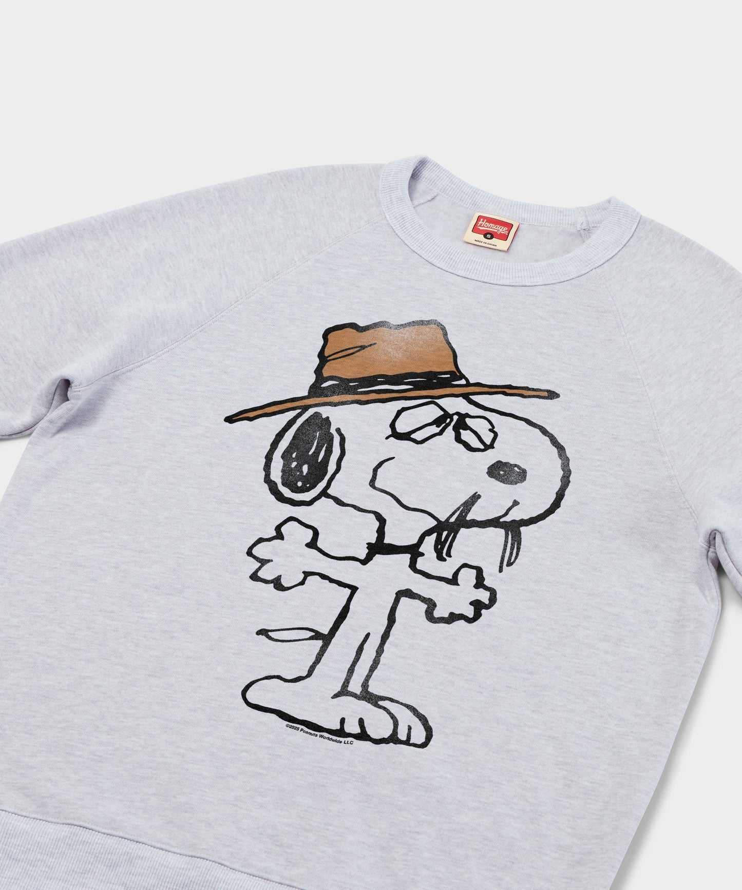 Close-up of the graphic print showing Spike smiling with his signature hat and whiskers