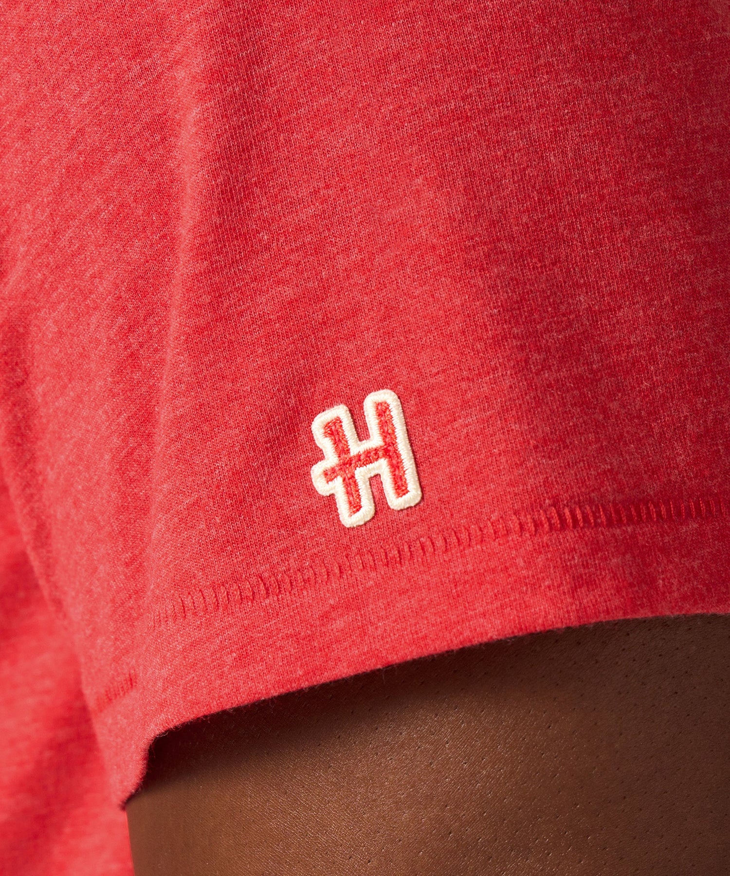 Detail shot of the collaborative collar tag showing HOMAGE and Peanuts branding