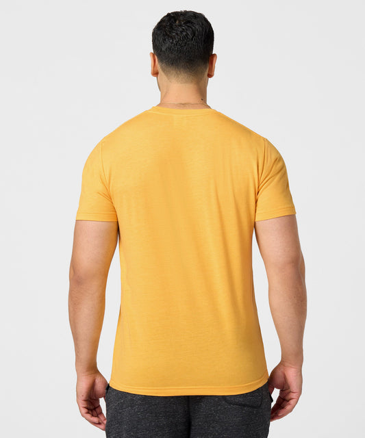 Gold HOMAGE t-shirt featuring a graphic of Woodstock from Peanuts centered on the front-3