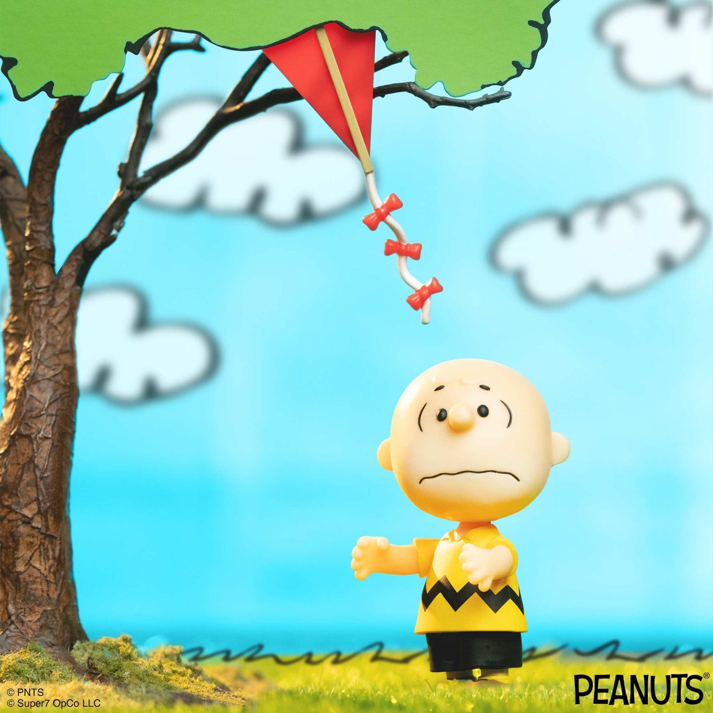 Retro-style 3 ¾ inch Charlie Brown action figure with red kite accessory.