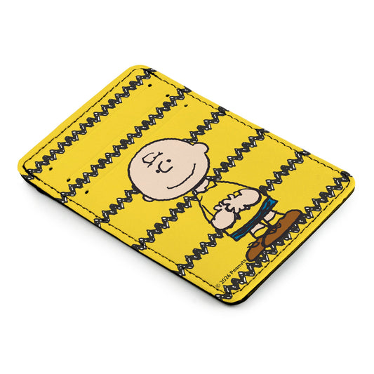 Charlie Brown in a standing pose on a yellow ID wallet with a black zig-zag stripe.-1